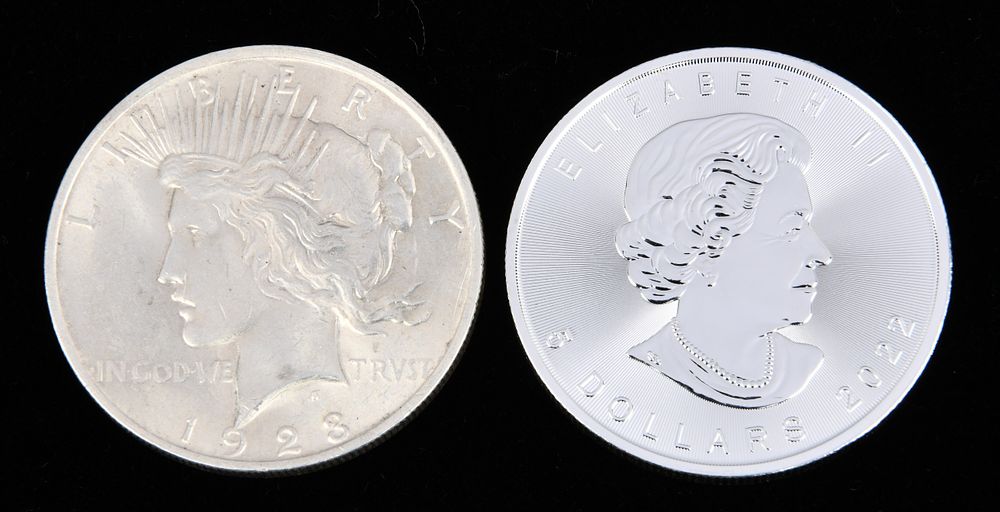 Lot 98: A 1928 American 'Peace Dollar' and a 2022 Canadian 'Silver Maple Leaf' Bullion Coin