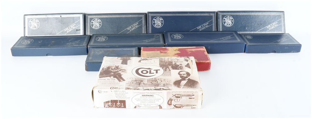 Lot 338: A Collection of 11 Vintage Smith & Wesson and Colt Factory Firearm Boxes