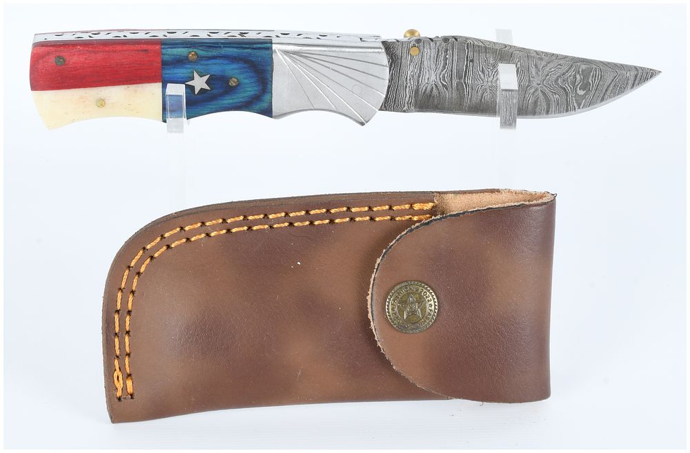 Lot 1289: Custom Handmade Damascus Folding Pocket Knife with Texas Flag Motif Handle and Leather Sheath