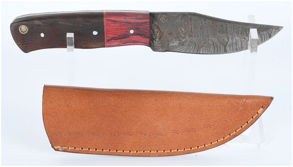 Lot 1379: A Fixed-Blade Hunting Knife with Damascus Steel Blade