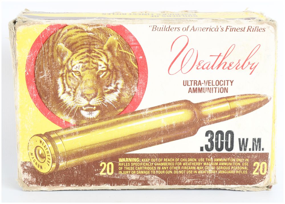 Lot 1445: Vintage Weatherby .300 W.M. Ultra-Velocity Ammunition 'Tiger Head' Box with 7 Live Rounds and 13 Empty Brass