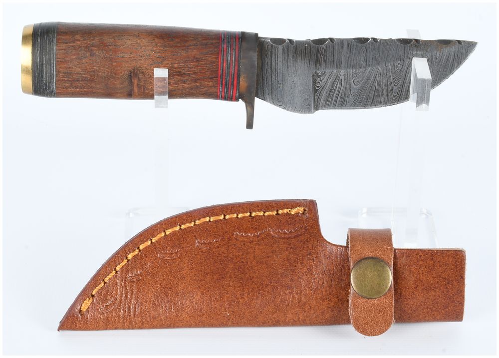 Lot 1478: A Fixed-Blade Damascus-Style Hunting Knife with Wood Handle and Leather Sheath