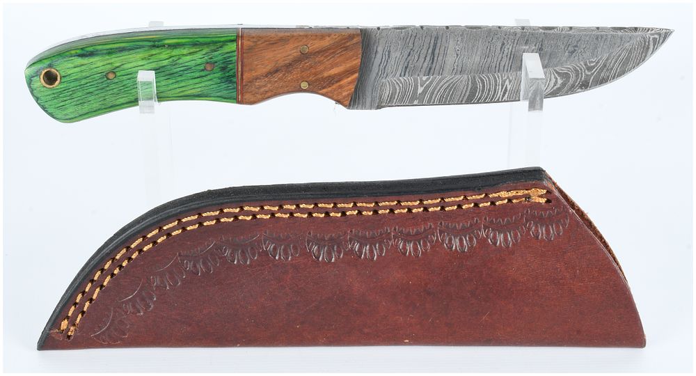 Lot 1538: A Modern Damascus Steel Fixed-Blade Knife with Two-Tone Handle and Tooled Leather Sheath