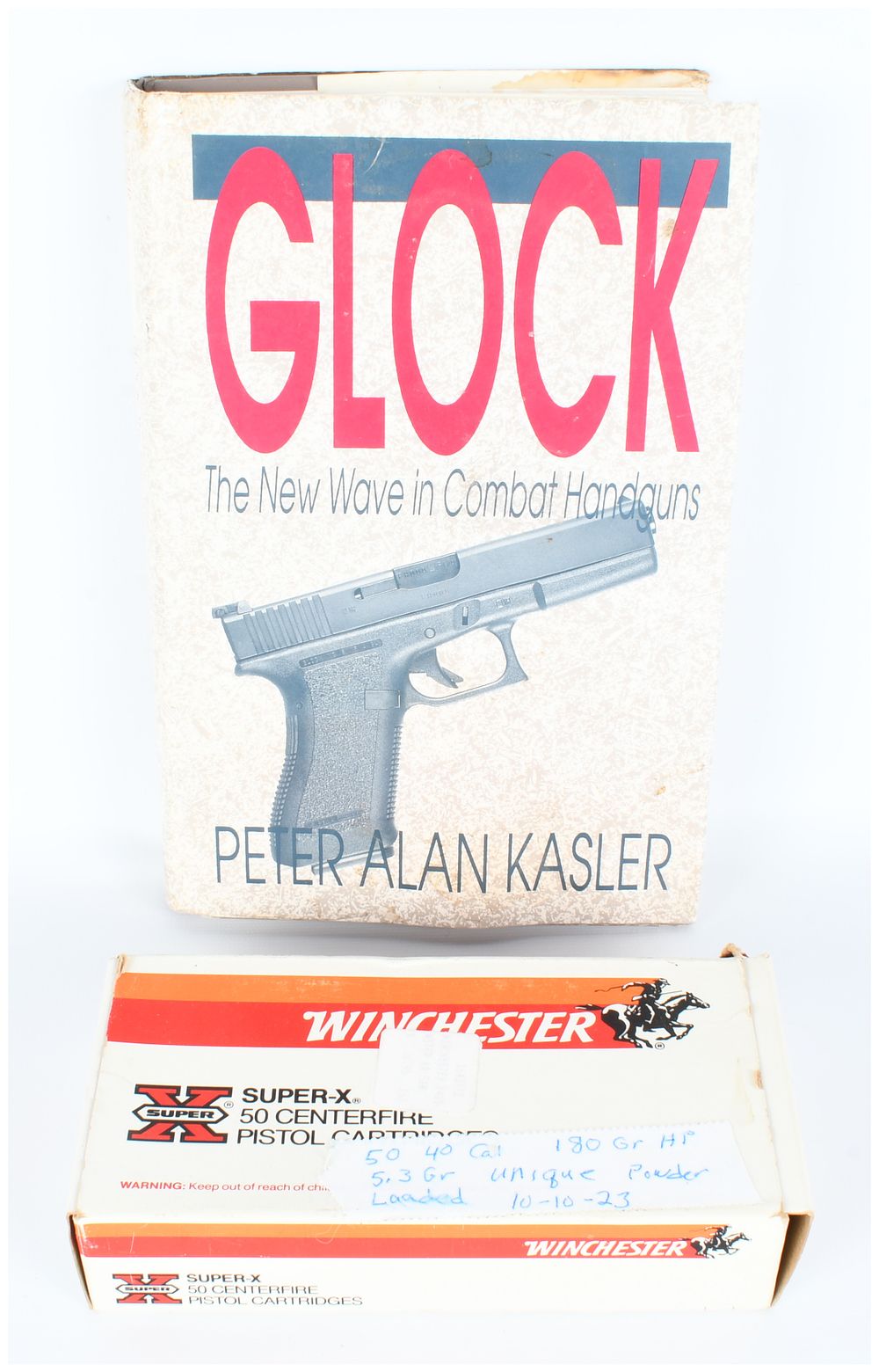 Lot 113: A Lot of Two Items: Peter Alan Kasler's Glock Book and Box of Reloaded .40 S&W Ammunition Components