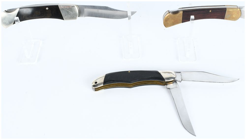 Lot 155: A Trio of Vintage and Promotional Folding Pocket Knives including Buck 317, Bear MGC, and Kutmaster