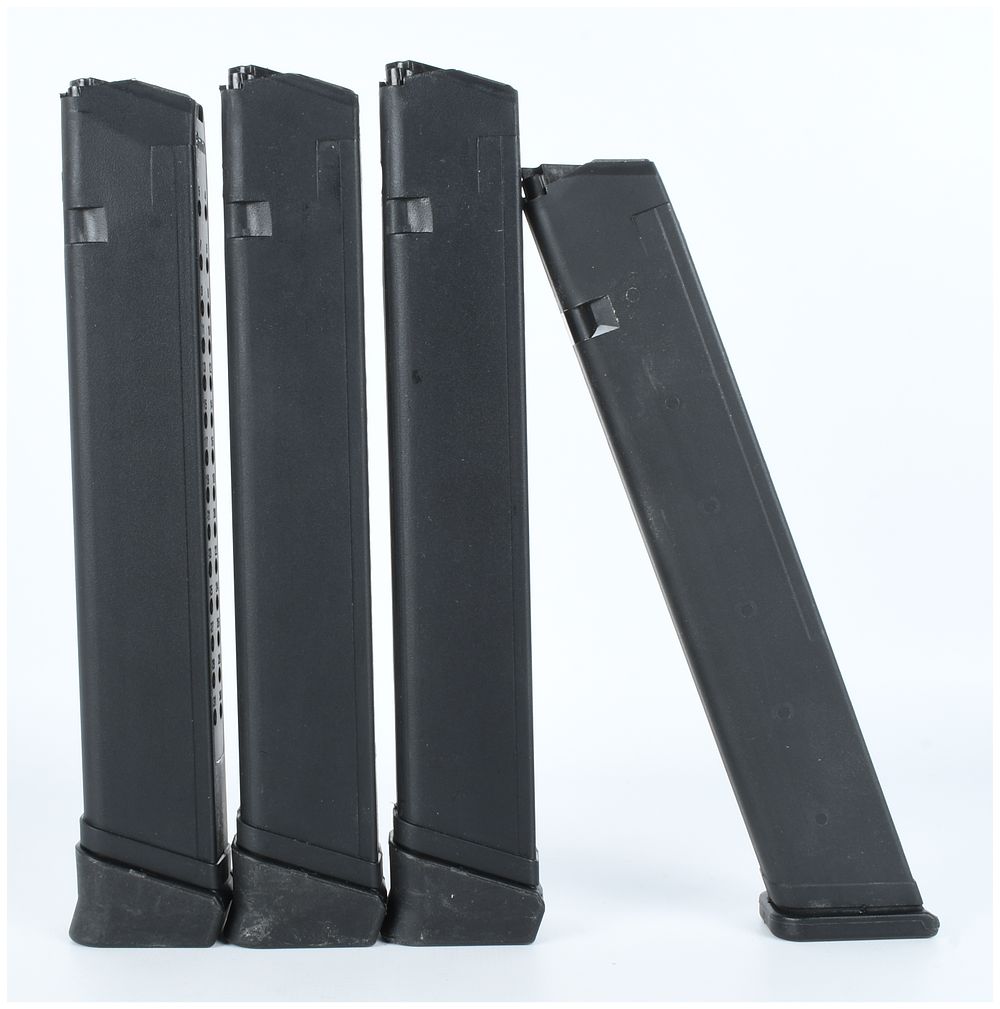 Lot 161: A Group of 4 Extended Capacity 9mm Pistol Magazines for Glock Pistols