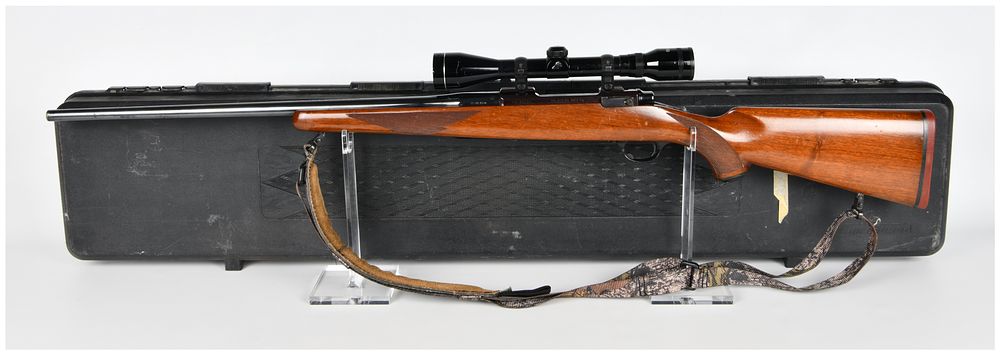 Lot 201: Ruger M77 Bolt Action Rifle in .25-06 REM. with Redfield Scope and Case