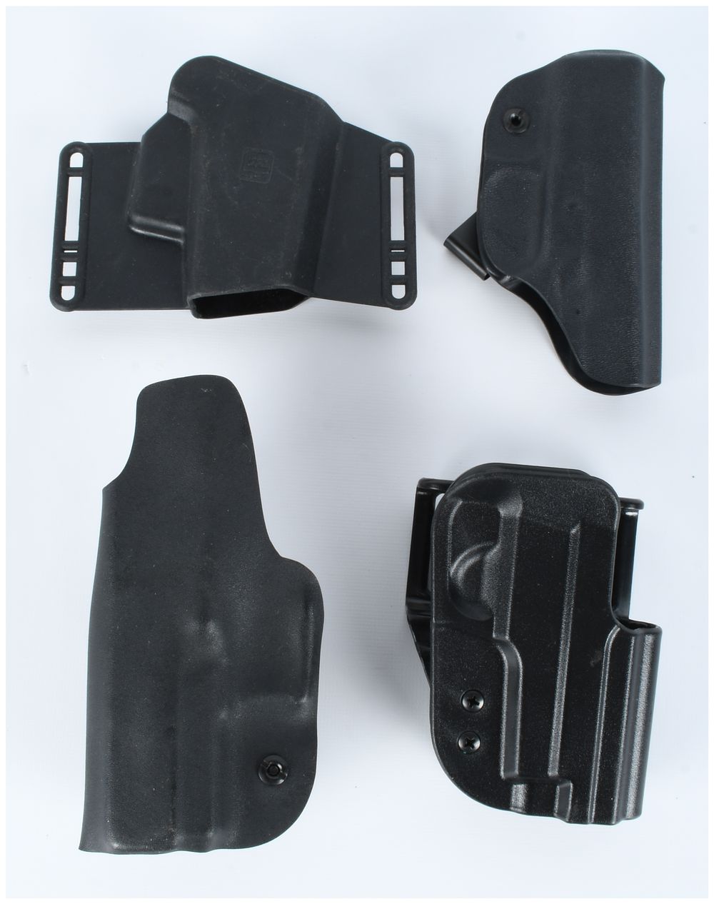 Lot 1076: A Collection of 4 Polymer Handgun Holsters including Glock and Uncle Mike's