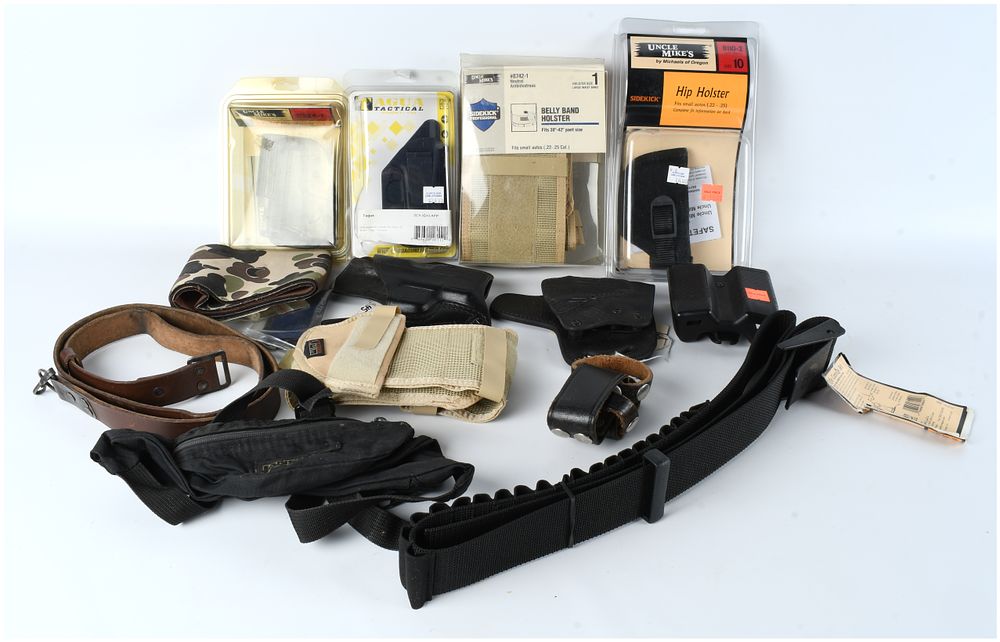 Lot 1204: A Collection of 12 Modern Concealed Carry and Tactical Firearm Accessories
