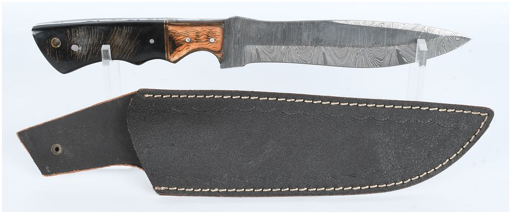 Lot 1334: A Damascus Steel Fixed Blade Hunting Knife and Leather Sheath
