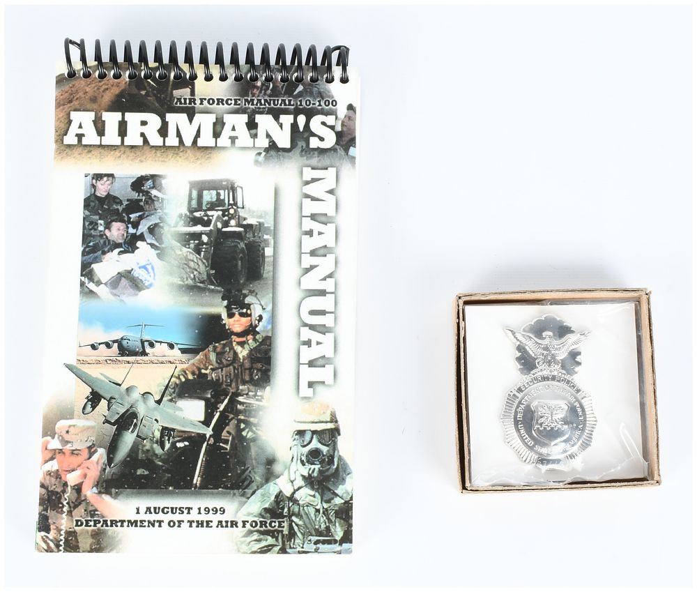 Lot 1460: A Pair of U.S. Air Force Collectibles: 1999 Airman's Manual 10-100 and Numbered Security Police Insignia Badge
