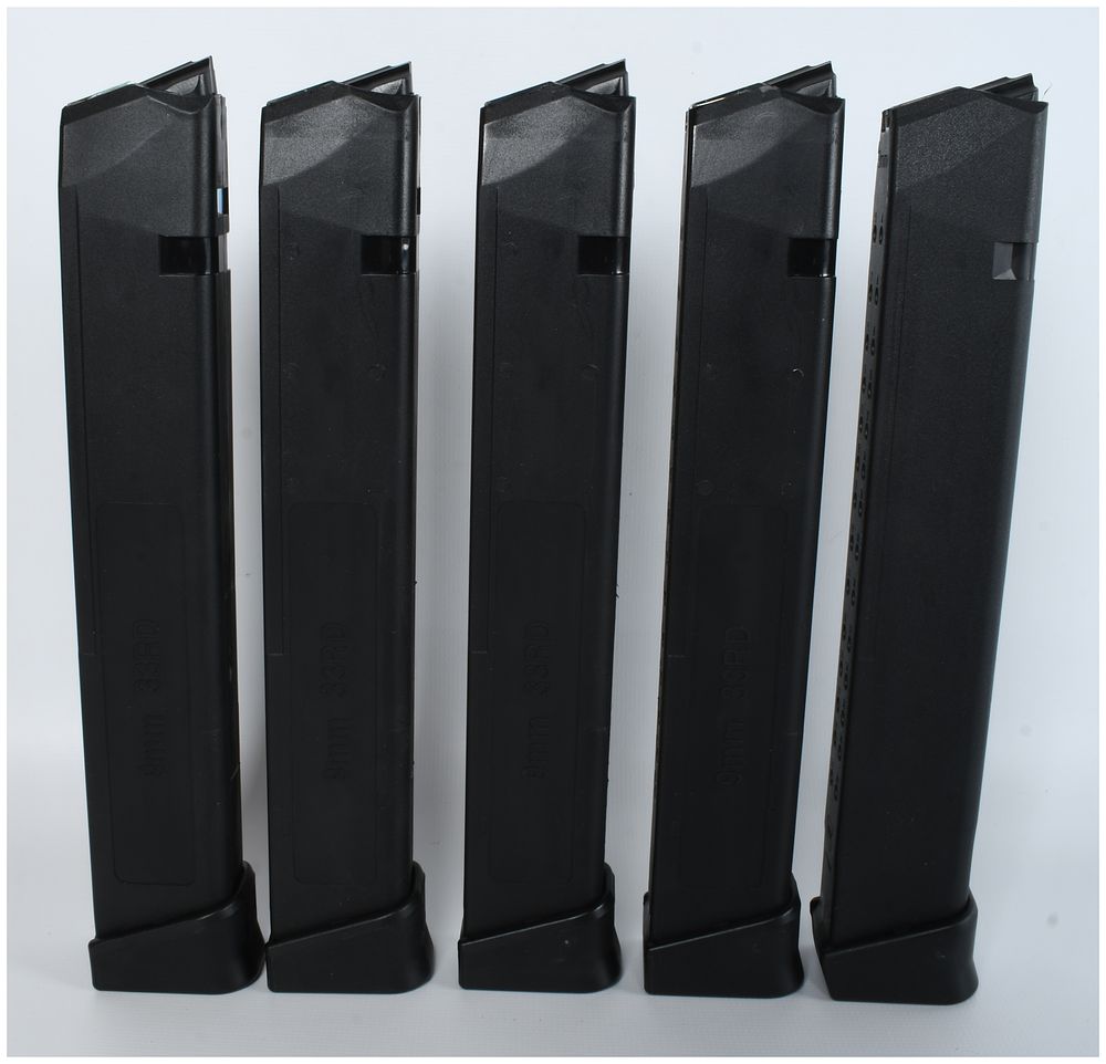 Lot 113: Five Glock 33-Round 9mm Luger Magazines