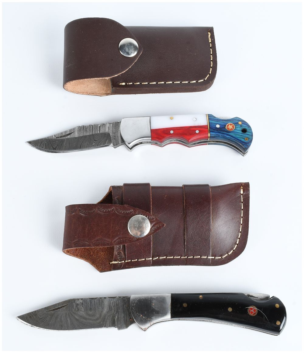 Lot 383: Two Damascus Steel Folding Pocket Knives with Leather Sheaths