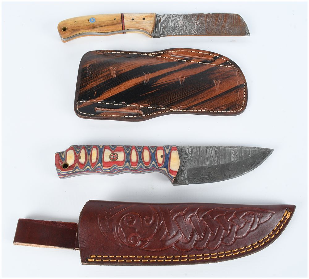 Lot 443: Two Damascus Steel Fixed Blade Knives with Tooled Leather Sheaths