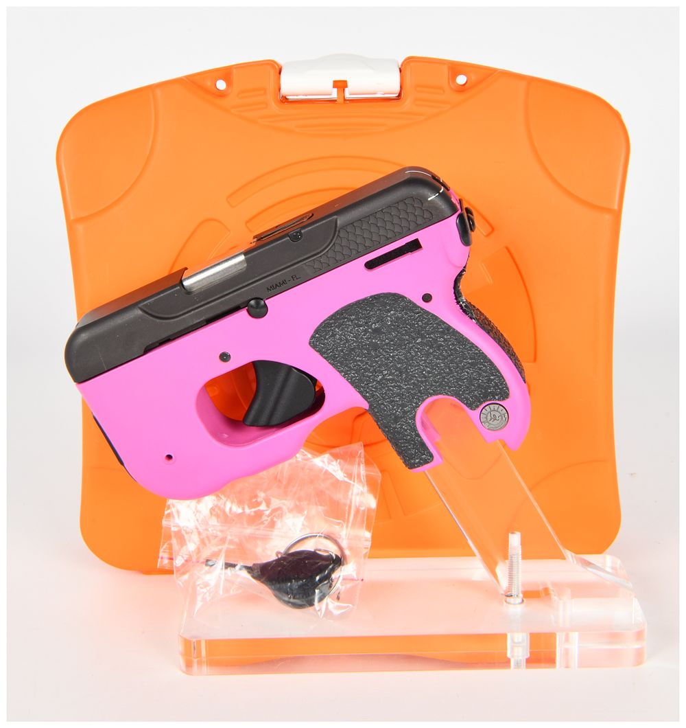 Lot 576: Taurus CURVE .380 AUTO Subcompact Semi-Automatic Pistol, Raspberry Frame, Integrated Laser/Light, Modern Production