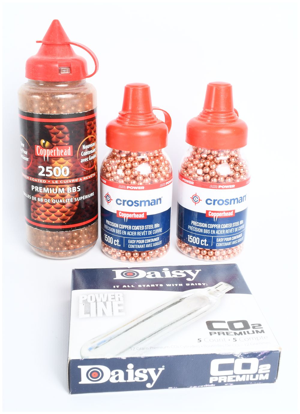 Lot 592: A Group of Crosman Copperhead BBs and Daisy Power Line CO2 Cylinders