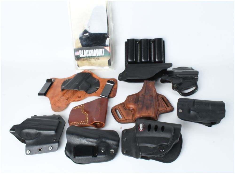 Lot 1193: An Assortment of Gun Holsters and Magazine Carriers including Blackhawk Fobus and Galco