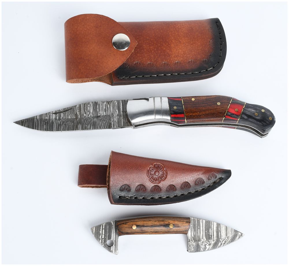Lot 1475: A Pair of Damascus Steel Knives with Leather Sheaths