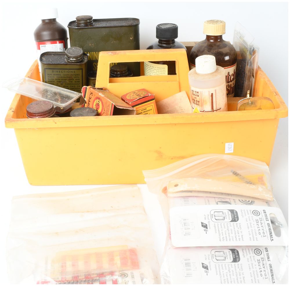 Lot 208: An Assortment of Gun Cleaning Supplies in a Penco Storage Caddy