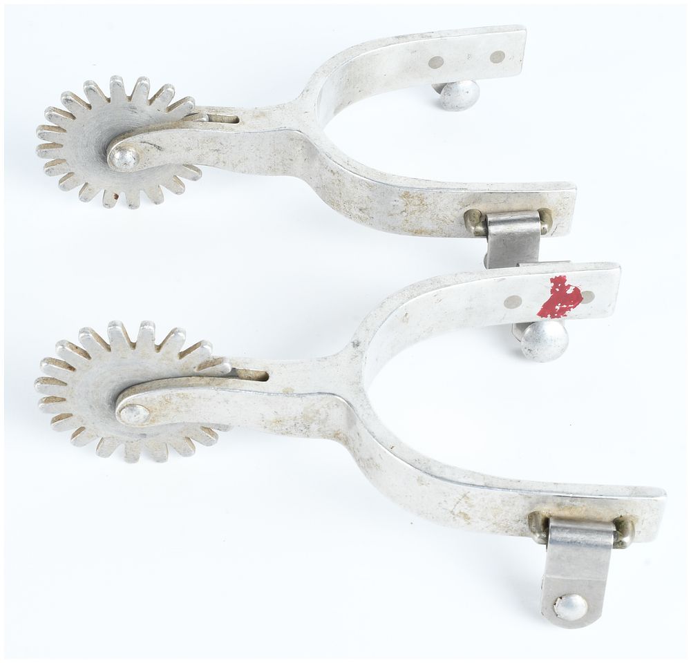 Lot 464: A Pair of Western Texas Style Equestrian Spurs with Large Star Rowels