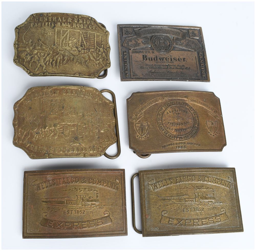 Lot 500: A Collection of 6 Commemorative and Advertising Cast Metal Belt Buckles