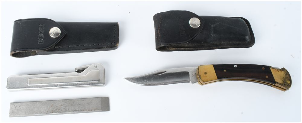 Lot 530: Two Buck Knives Model 110 Folding Hunter and Model 137 Honing Steel with Sheaths
