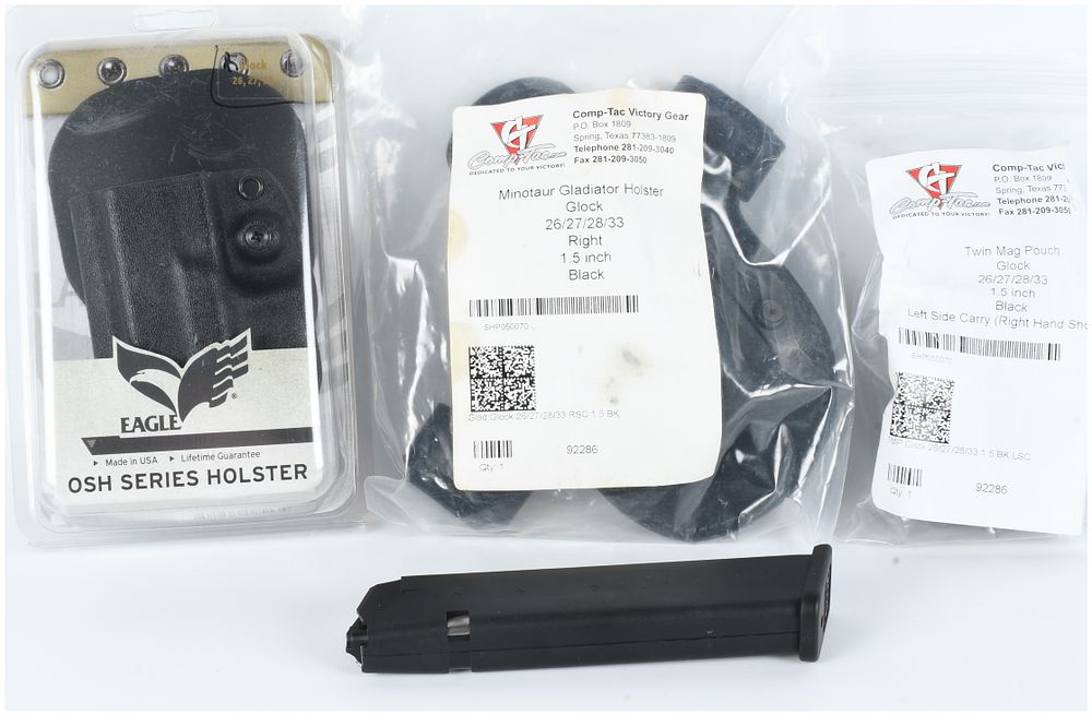 Lot 1469: A Collection of Glock Handgun Accessories and Extended Magazine