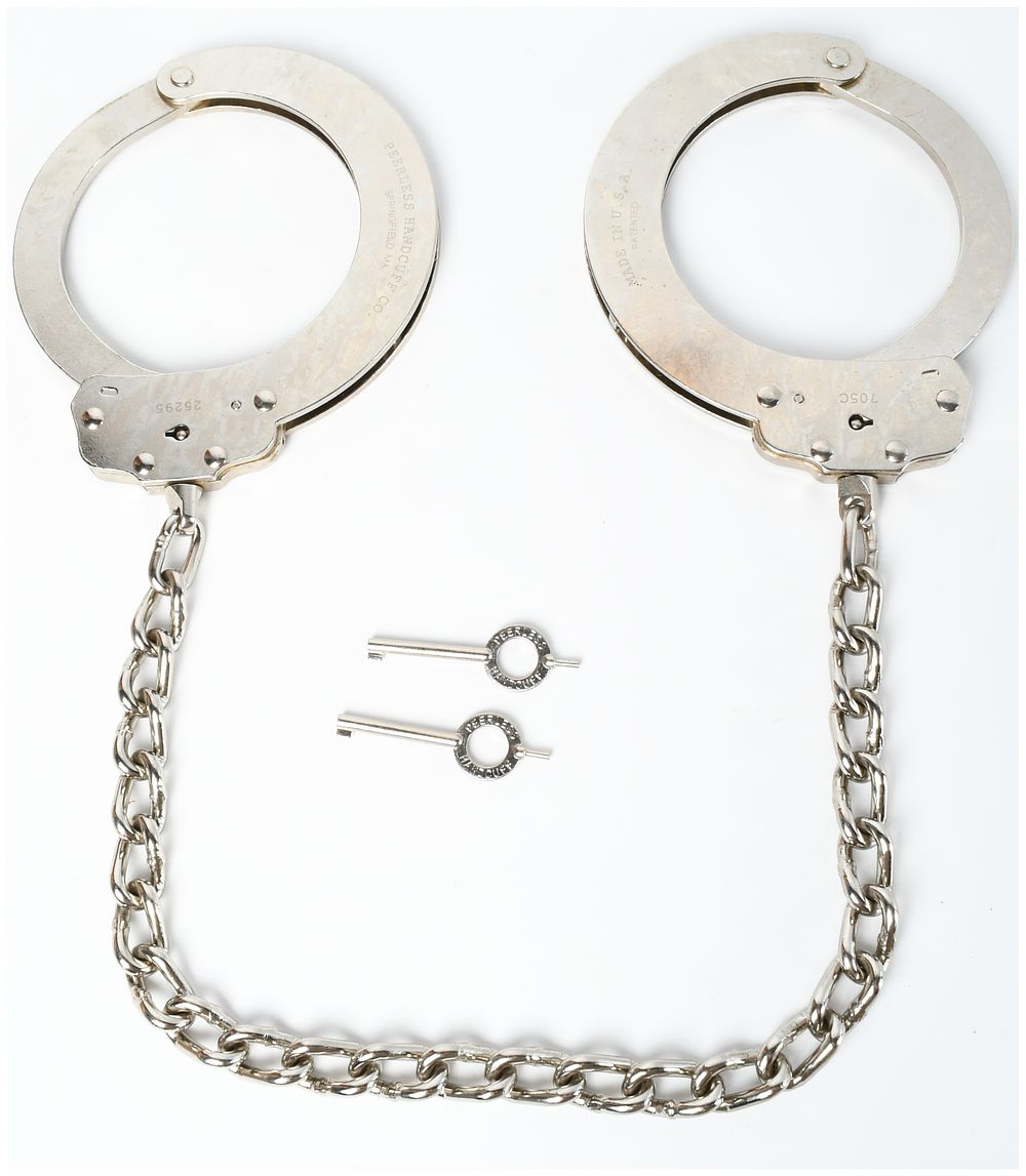 Lot 86: A Pair of Vintage Peerless Handcuff Co. Model 705C Nickel-Plated Leg Irons with Keys