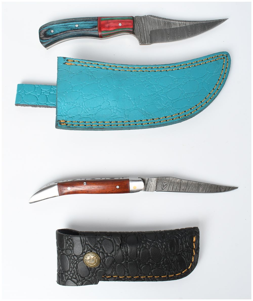 Lot 419: Two Damascus Steel Knives with Embossed Leather Sheaths