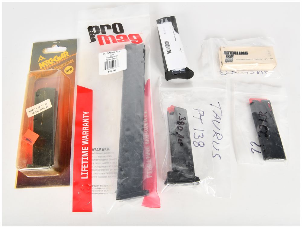 Lot 449: A Lot of 6 Firearm Magazines and Accessories Including Mec-Gar, ProMag, and Taurus Examples