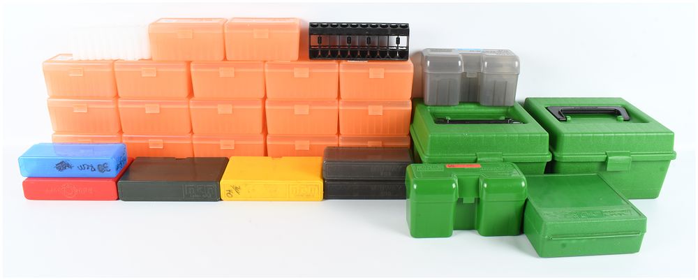 Lot 1121: A Lot of 28 MTM Case-Gard and Midway Ammunition Storage Containers and Racks