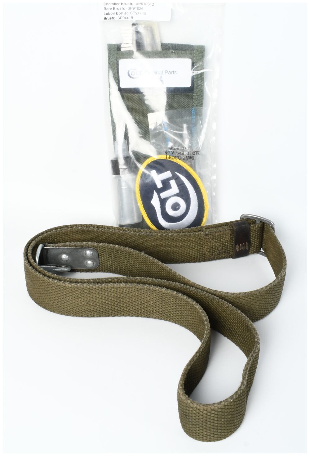 Lot 1448: A Lot of Two Firearms Accessories Including a Colt Cleaning Kit and USGI Web Sling