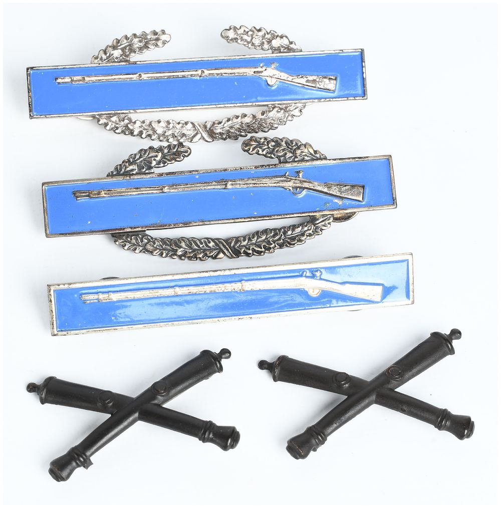 Lot 359: An Assortment of Mid-20th Century US Army Sterling Silver Infantry and Field Artillery Insignia