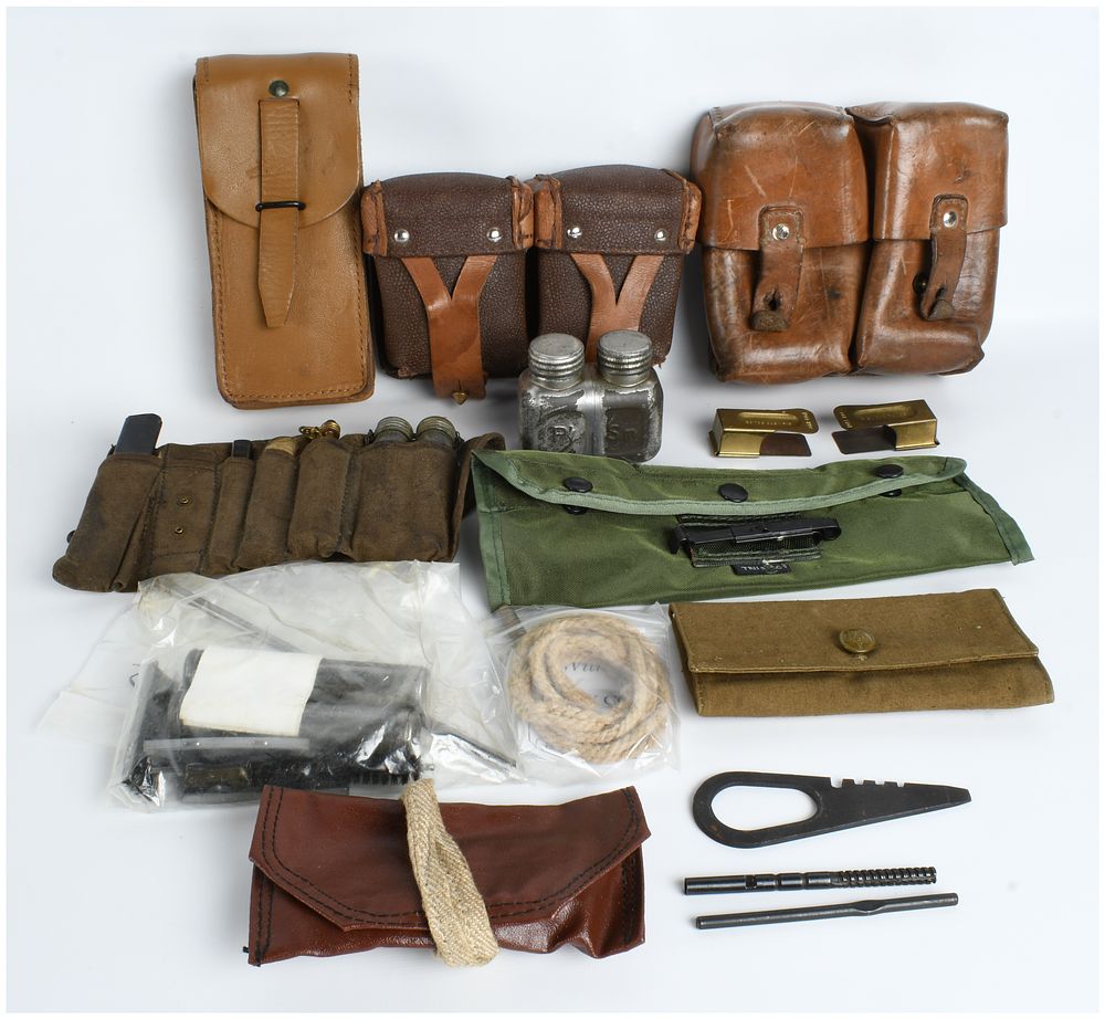 Lot 374: A Collection of US and European Military Field Gear, Weapon Maintenance Kits, and Commemorative Items