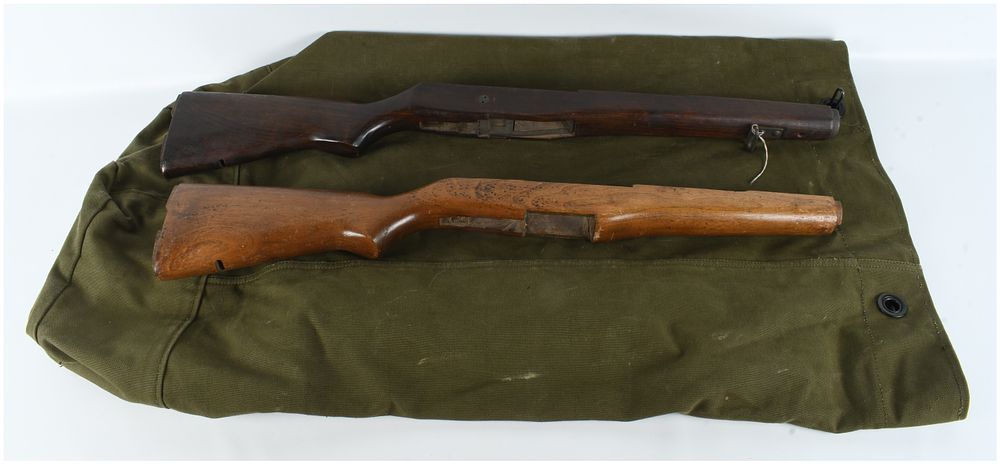 Lot 611: A Pair of US Military Wooden Stocks with Canvas Bag