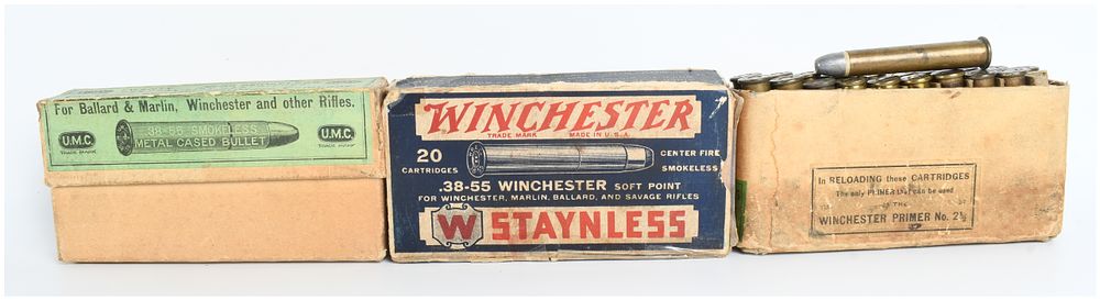 Lot 1165: A Lot of 26 Live Rounds and 20 Empty Brass Casings .38-55 Winchester with Three Vintage Boxes
