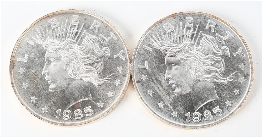 Lot 68: A Pair of 1985 Peace Dollar Design 1 ozt .999 Silver Trade Units
