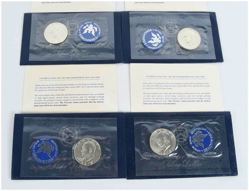 Lot 290: Four US 40% Silver Eisenhower Uncirculated Blue Pack Dollars 1972-S and 1973-S