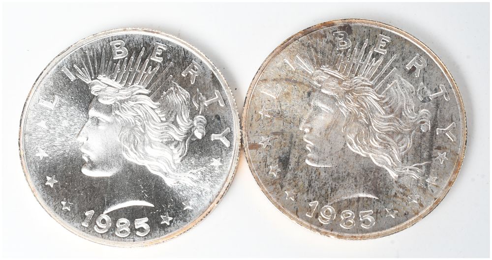 Lot 398: A Pair of 1985 Peace Dollar Design Silver Trade Units