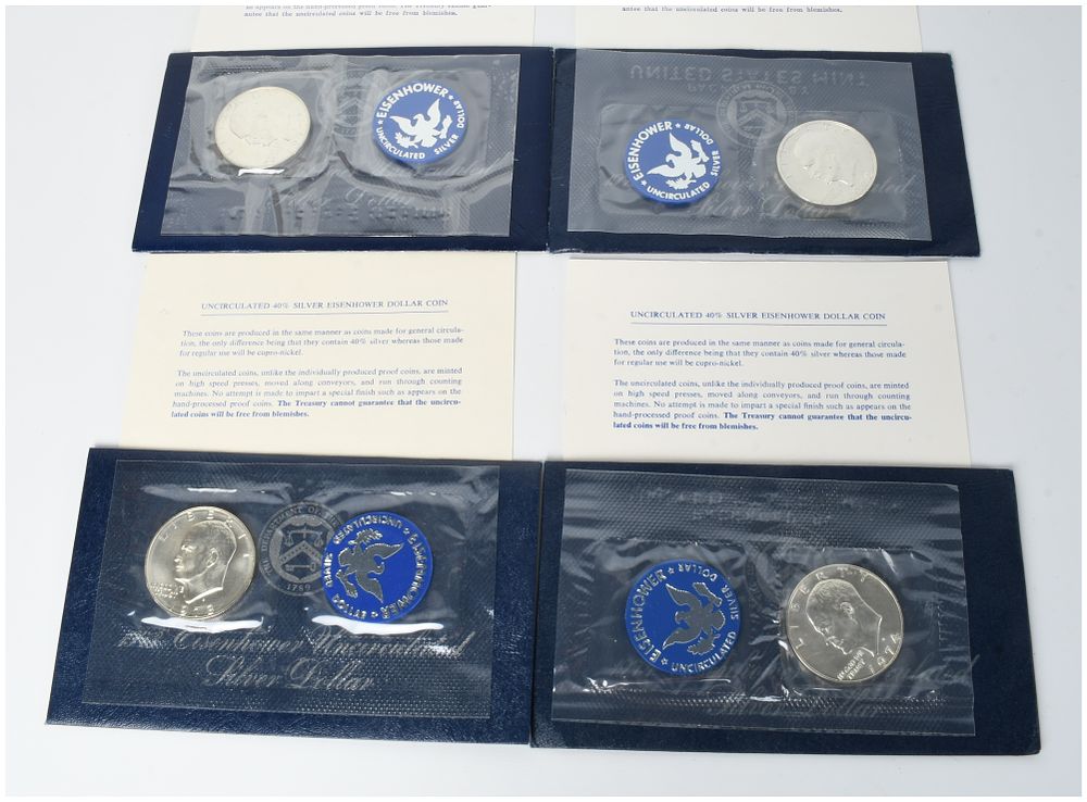 Lot 410: A Set of 4 US 1971-1974-S Eisenhower 40% Silver Dollars in Original Blue Pack Packaging