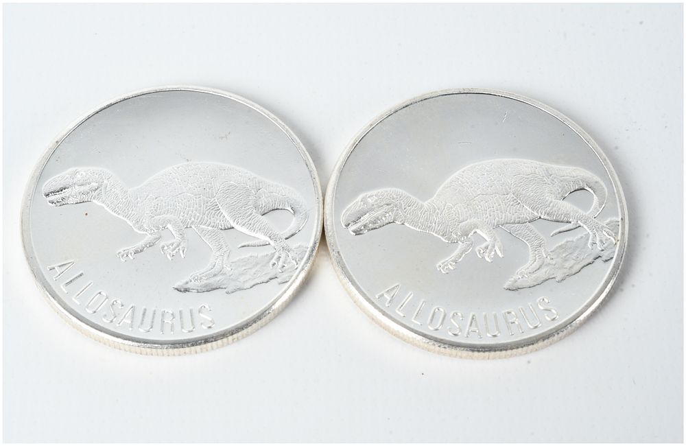 Lot 458: A Pair of Allosaurus 1 Troy Ounce .999 Fine Silver Bullion Rounds