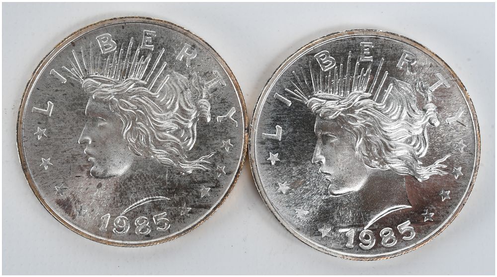 Lot 488: A Pair of 1985 Peace Dollar Design 1 oz t .999 Silver Trade Units