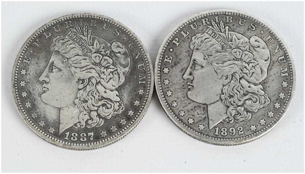 Lot 1127: A Pair of US Morgan Silver Dollars, 1887 and 1892