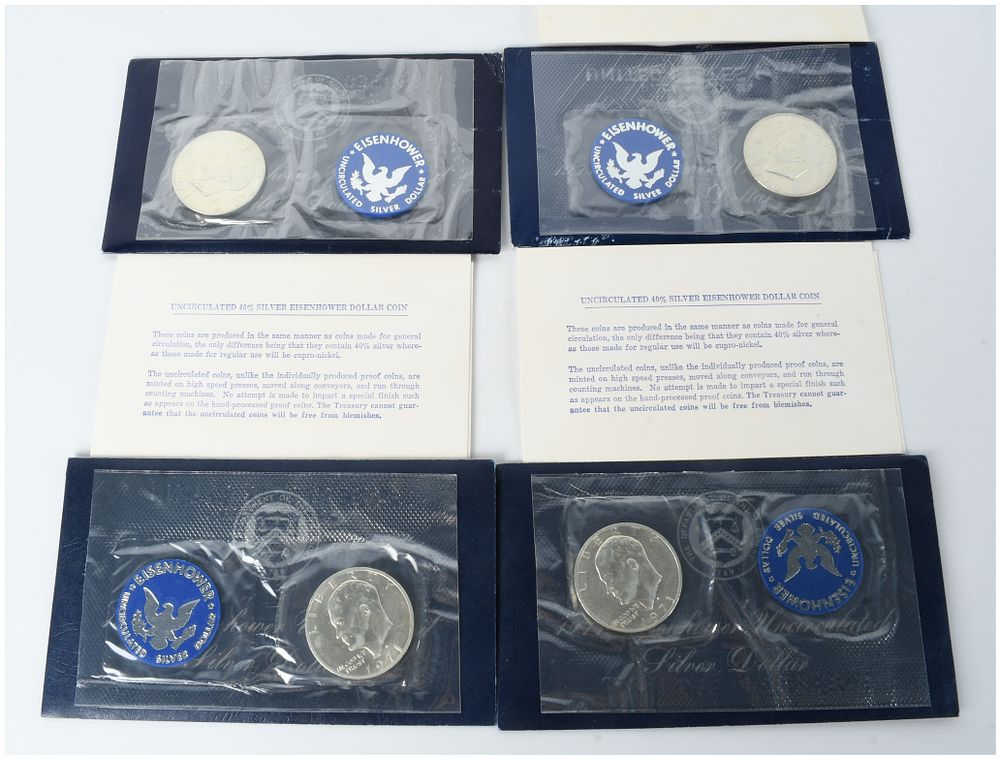 Lot 1169: Four 1971-S US Eisenhower Uncirculated 40% Silver Dollars in Original Blue Pack Government Packaging