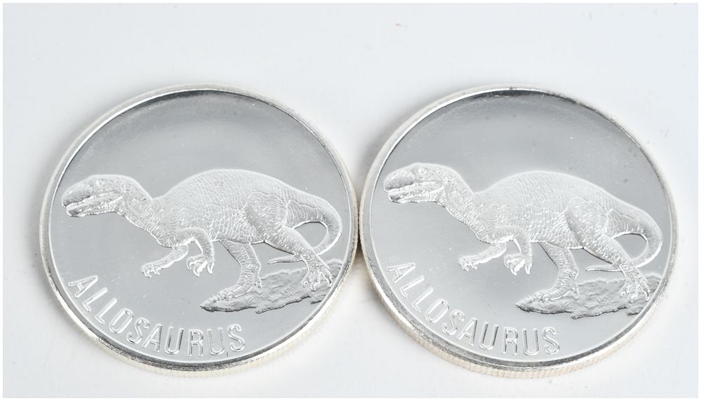 Lot 1277: A Pair of Allosaurus 1 Ounce .999 Fine Silver Bullion Rounds