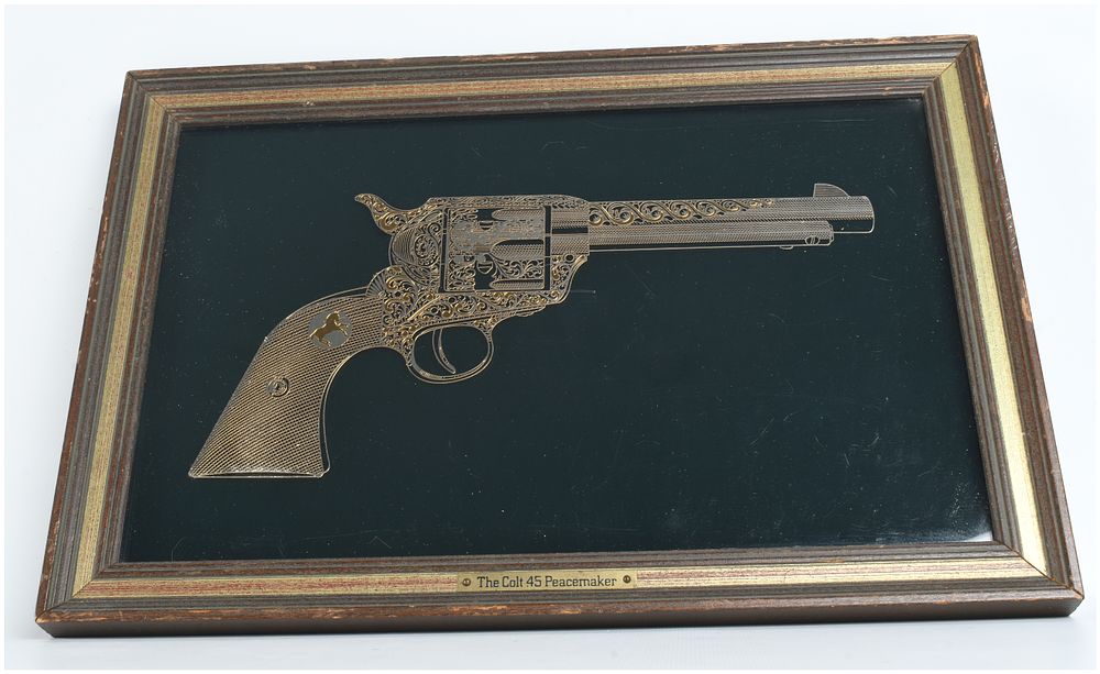 Lot 53: Franklin Mint, The Colt .45 Peacemaker, Sterling Silver and 24 Karat Gold Silhouette Artwork, 1979