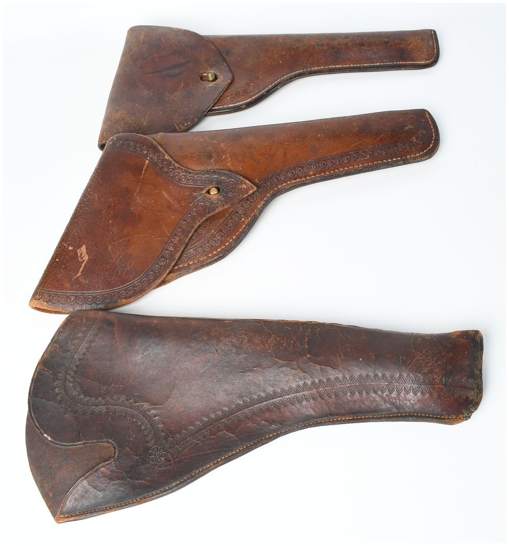 Lot 257: A Trio of Vintage Brown Leather Revolver Holsters