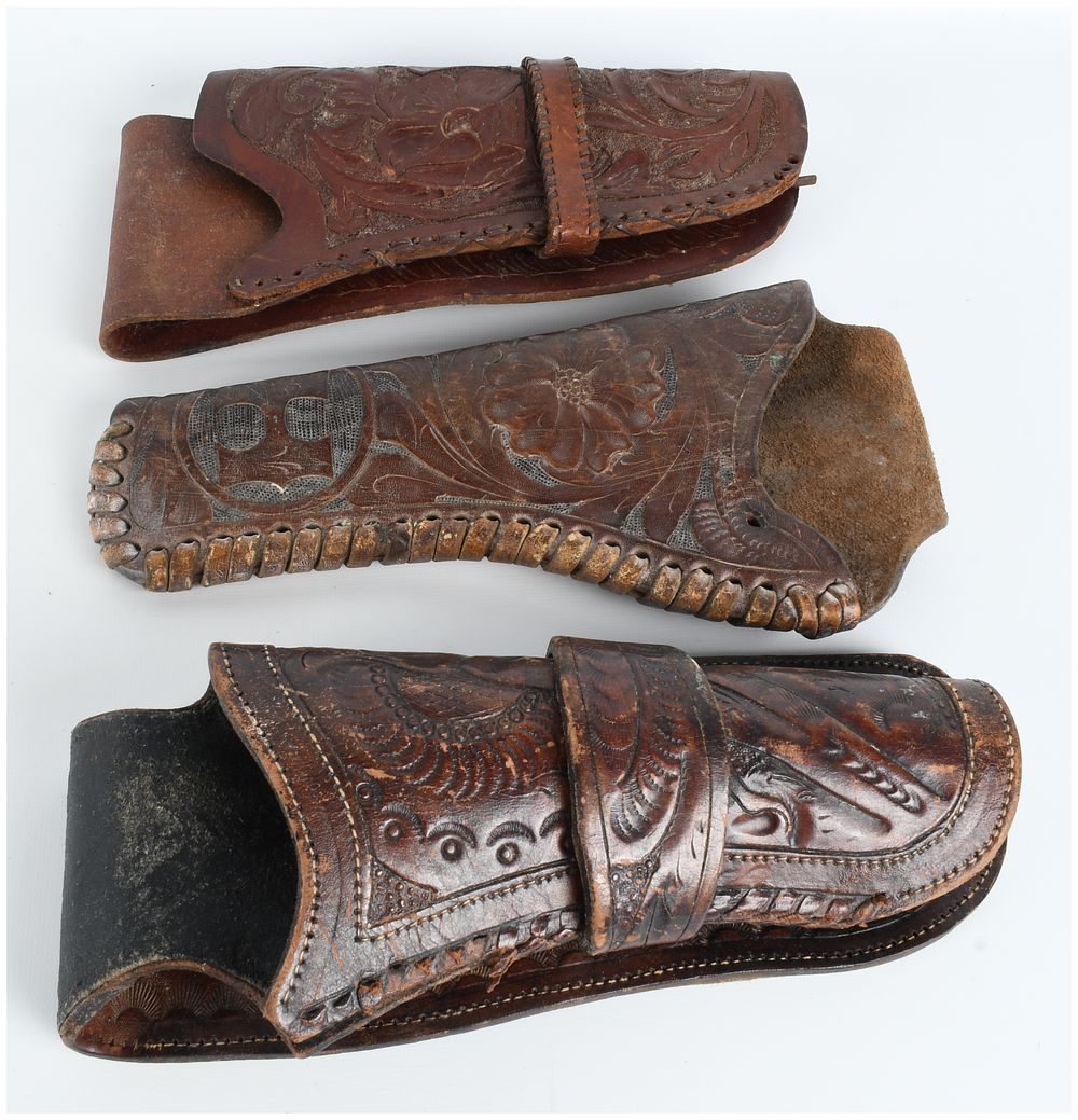 Lot 437: A Trio of Tooled Leather Western Style Revolver Holsters Antique