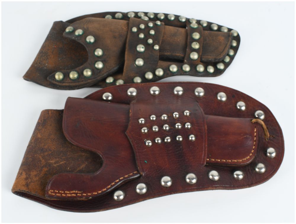 Lot 497: Two Vintage Studded Leather Western-Style Revolver Holsters
