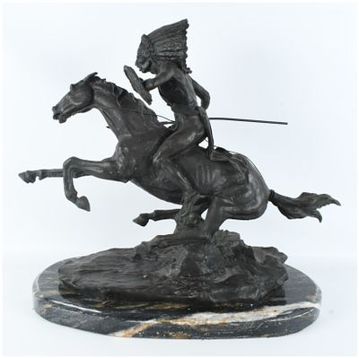 Frederic Remington Warrior Bronze Sculpture on Marble Base. This bronze-patinated sculpture is a 